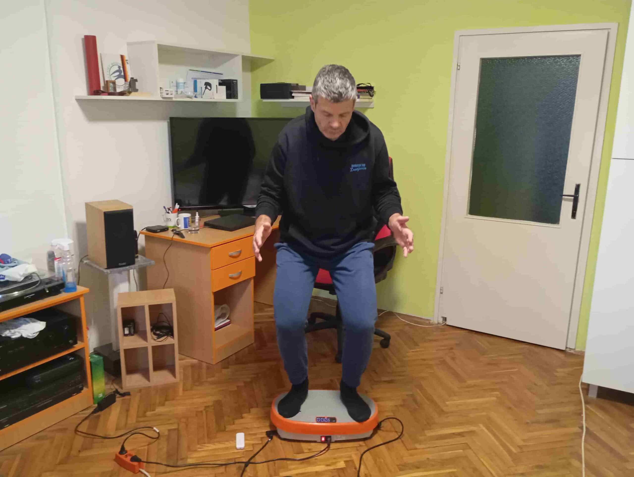 Vladimir Stanar on a vibration plate in a half squat Vladimir Stanar on a vibration plate in a half squat