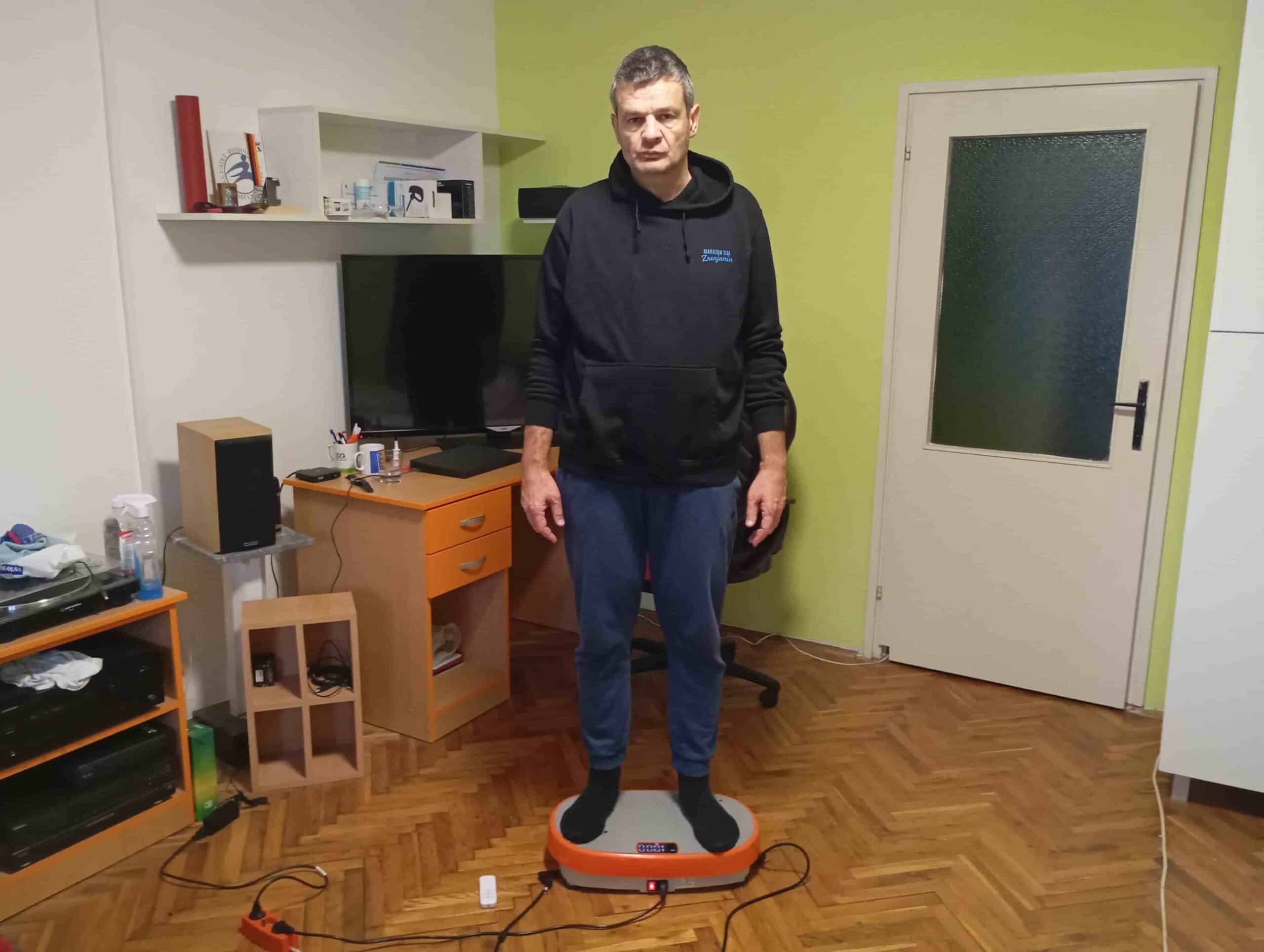 Vladimir Stanar standing on a vibration plate Vladimir Stanar standing on a vibration plate
