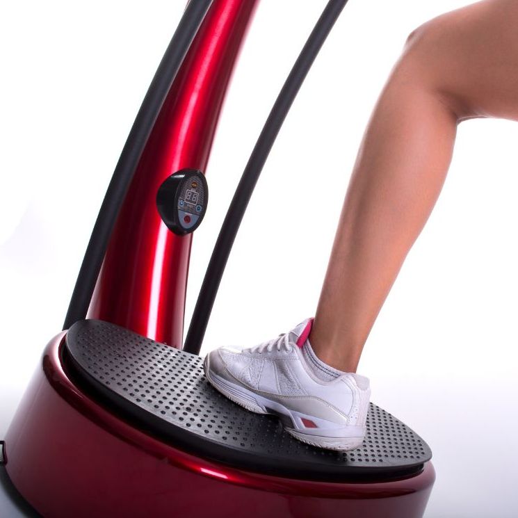 A person stepping on a vibration plate