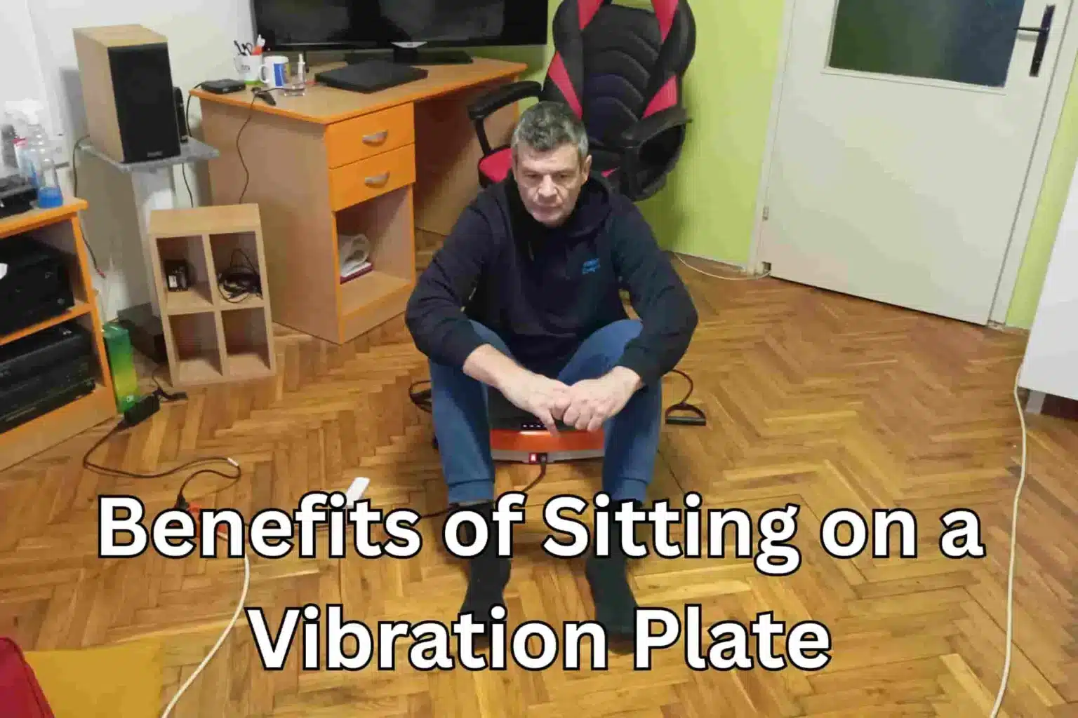 Benefits of Sitting on a Vibration Plate featured image of Vladimir Stanar sitting on a vibration platform in his living room